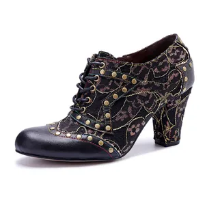 Vintage black lace high heel bootie featuring genuine leather patches and gold studs