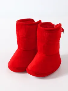 Detailed view of red soft sole baby winter boots featuring a warm and cozy plush lining