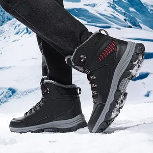 Close-up view of men's durable black snow boots with warm faux-fur lining stepping on snow