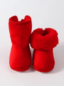 Cozy red faux fur baby winter boots with soft sole for infants aged 6-12 months.