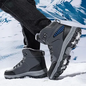 Warm waterproof men's hiking snow boots shown in a cold snowy outdoor mountain scene
