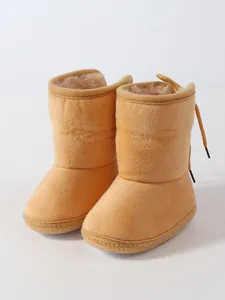 Cozy beige soft-sole baby winter boots featuring warm faux fur lining for infants.