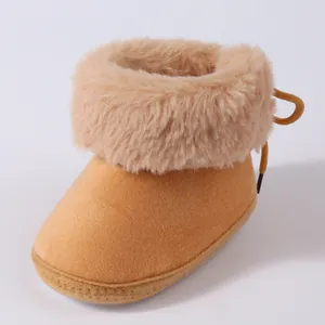 Close-up shot of soft plush baby winter toddler boot featuring a fluffy faux fur collar