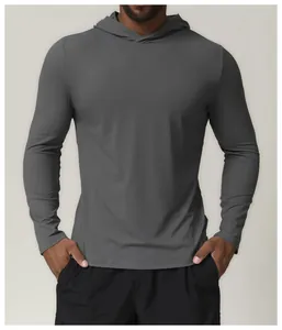 Close-up detail of men's athletic dark grey long sleeve hoodie with quick-dry performance fabric