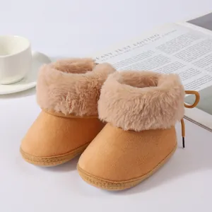 Macro detail of infant winter snow boots featuring soft sole and plush faux fur trim