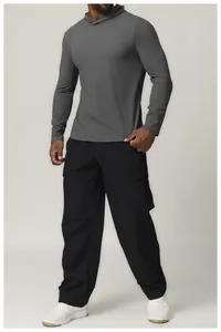 Full-body view of a men's grey quick-dry performance hoodie and black cargo pants.