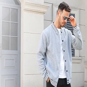 Detail of a men's vintage grey fleece varsity baseball jacket with snap buttons.
