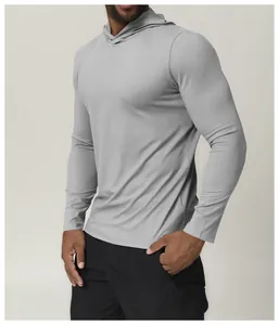 Detail view of a men's light grey hooded quick-dry long sleeve athletic shirt for fitness.