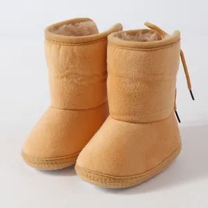 Cozy orange baby winter boots with soft sole for infants aged 6-12 months old.