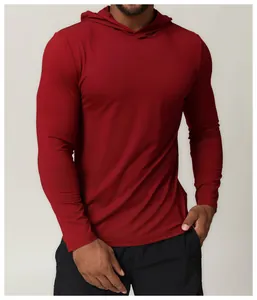 Macro view of a men's athletic hooded quick-dry long-sleeved red sports T-shirt.