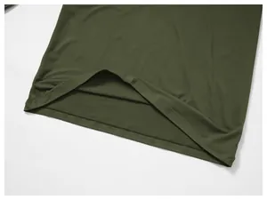 Close-up detail of the hem and stitching on an olive green quick-dry athletic shirt
