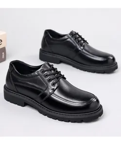 Detailed side view of men's black genuine leather dress shoes with thick non-slip soles