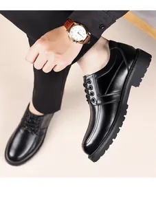 Close-up of black leather business shoes with thick lug soles and lace-up design