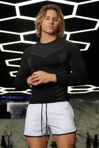 Athletic men's slim-fit long-sleeve compression shirt for gym and sports training