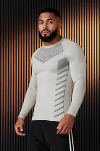 Men's athletic slim-fit long-sleeve sports shirt featuring grey geometric graphic designs