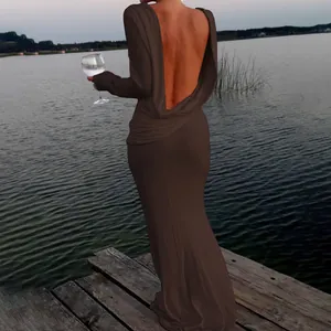 Back view detail of an elegant brown backless long-sleeved maxi dress for formal wear