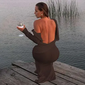 Detail showing the deep backless design of the dark brown long sleeve maxi dress