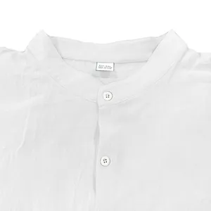 Close-up of a white cotton men's shirt with mandarin collar and white buttons detail