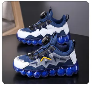 Close-up of boys' breathable blue sneakers featuring a quick rotary buckle dial