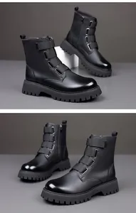 Side view of black leather combat boots with thick lug soles and strap design