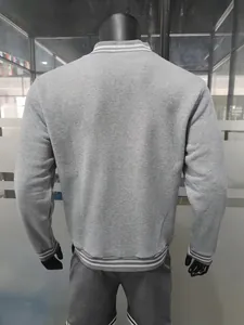 Back view of grey fleece baseball jacket showing striped stand collar and ribbed hem