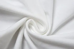 Détail macro du tissu élastique blanc haute qualité pour robe d'hiver élégante