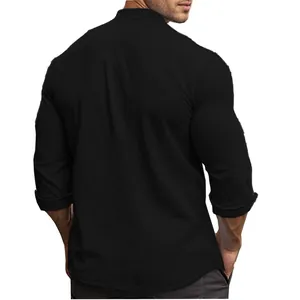 Rear view of men's slim fit black cotton shirt with stand collar and rolled sleeves.