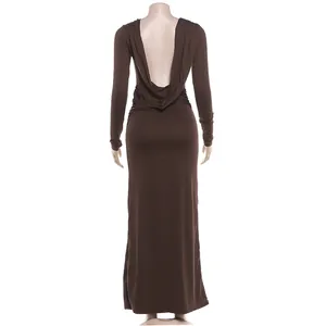 Back view of an elegant brown long-sleeve backless maxi dress with drape detail.