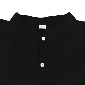 Close-up detail of a black stand-collar men's cotton shirt showing the buttons and collar