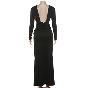 Elegant black long-sleeved maxi dress featuring a deep V-shaped open back design