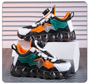 Detailed side view of boys' breathable sneakers with rotating buckle lacing