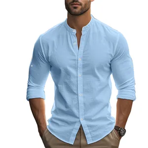 Close-up detail of light blue men's slim fit long-sleeve cotton shirt with stand collar