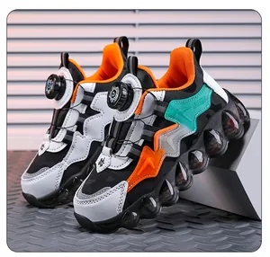 Close-up of boys' chunky athletic shoes featuring a convenient rotary button closure