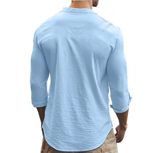 Detail view of the back of a light blue men's slim fit cotton shirt with a mandarin collar