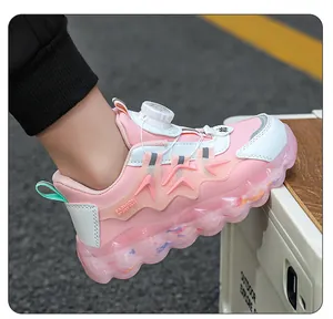 Close-up detail of pink children's sneakers featuring a convenient rotary buckle system