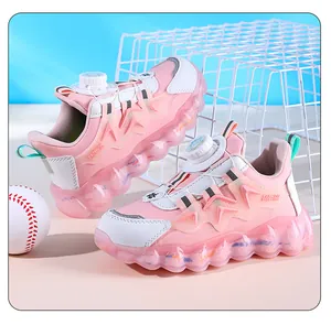 Pink and white boys sneakers with dial lace system and chunky transparent sole