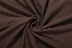 Macro view of soft brown knit fabric detail for elegant long sleeve evening dress