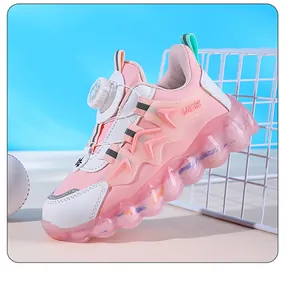 Close-up side view detail of pink children's sports sneakers with rotating buckle dial