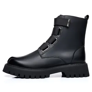 Side view of black leather Martin boots for men with chunky lug soles and buckled straps.