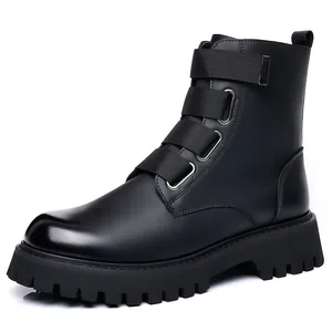 Detail view of black leather combat boots with platform lug sole and buckle straps.