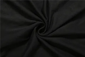 Close-up macro shot of premium black dress fabric texture with elegant soft drapes.
