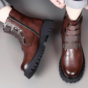 Vintage brown leather Martin boots with chunky platform soles and buckle straps for men.