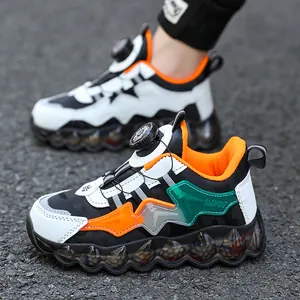 Boys' breathable chunky sneakers with rotating buckle closure in black and orange.