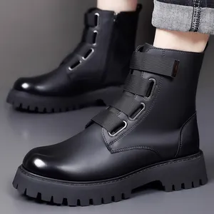 Professional shot of men's black leather Martin boots with side zipper and strap buckles