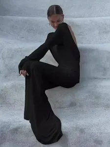 Elegant long-sleeve backless black evening dress for women with slim fit design.