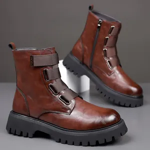 Detail view of brown leather Martin boots featuring metal buckles and a side zipper closure