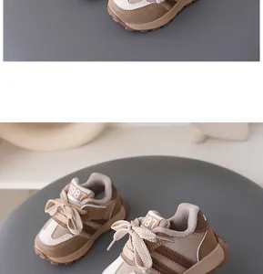 Detailed view of children's khaki leather sneakers featuring '1987' logo on the tongue