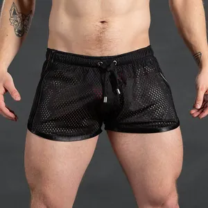 Detail view of men's breathable black mesh sports shorts with quick-dry fabric