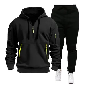 Detailed view of men's black sports hoodie set with multi-pocket and lime green accents