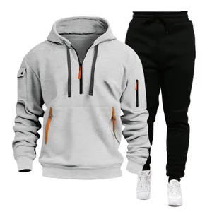 Detailed look at men's grey hooded sweatshirt and black drawstring joggers sports tracksuit set